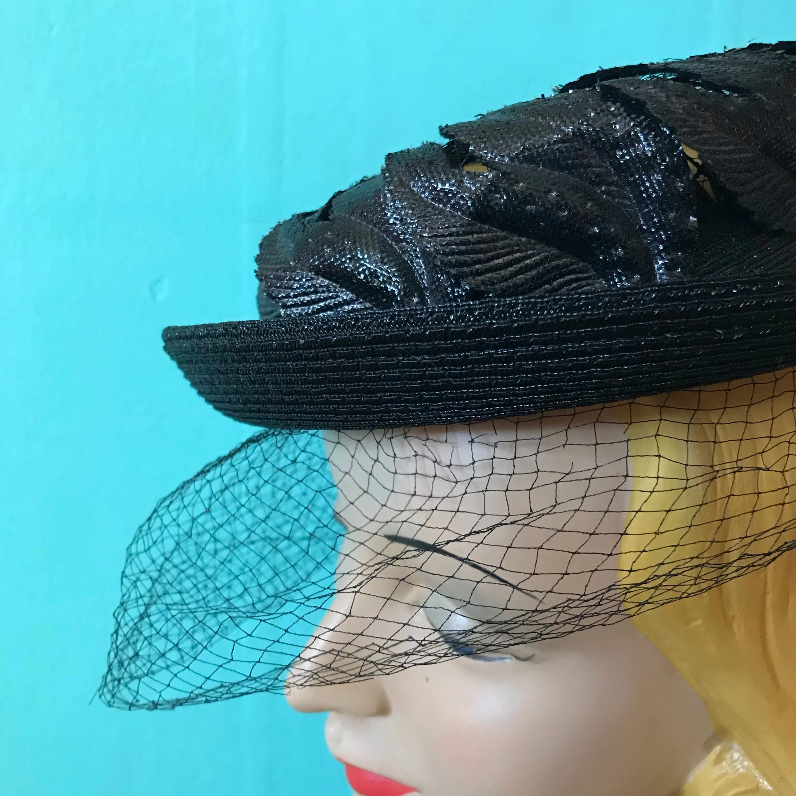 Black Narrow Brimmed Boater Style Hat with Flame Shaped Leaves on Open Top circa 1960s